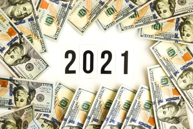 2021 surrounded by $100 bills