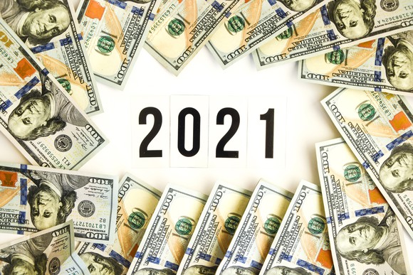 The number 2021 surrounded by hundred dollar bills