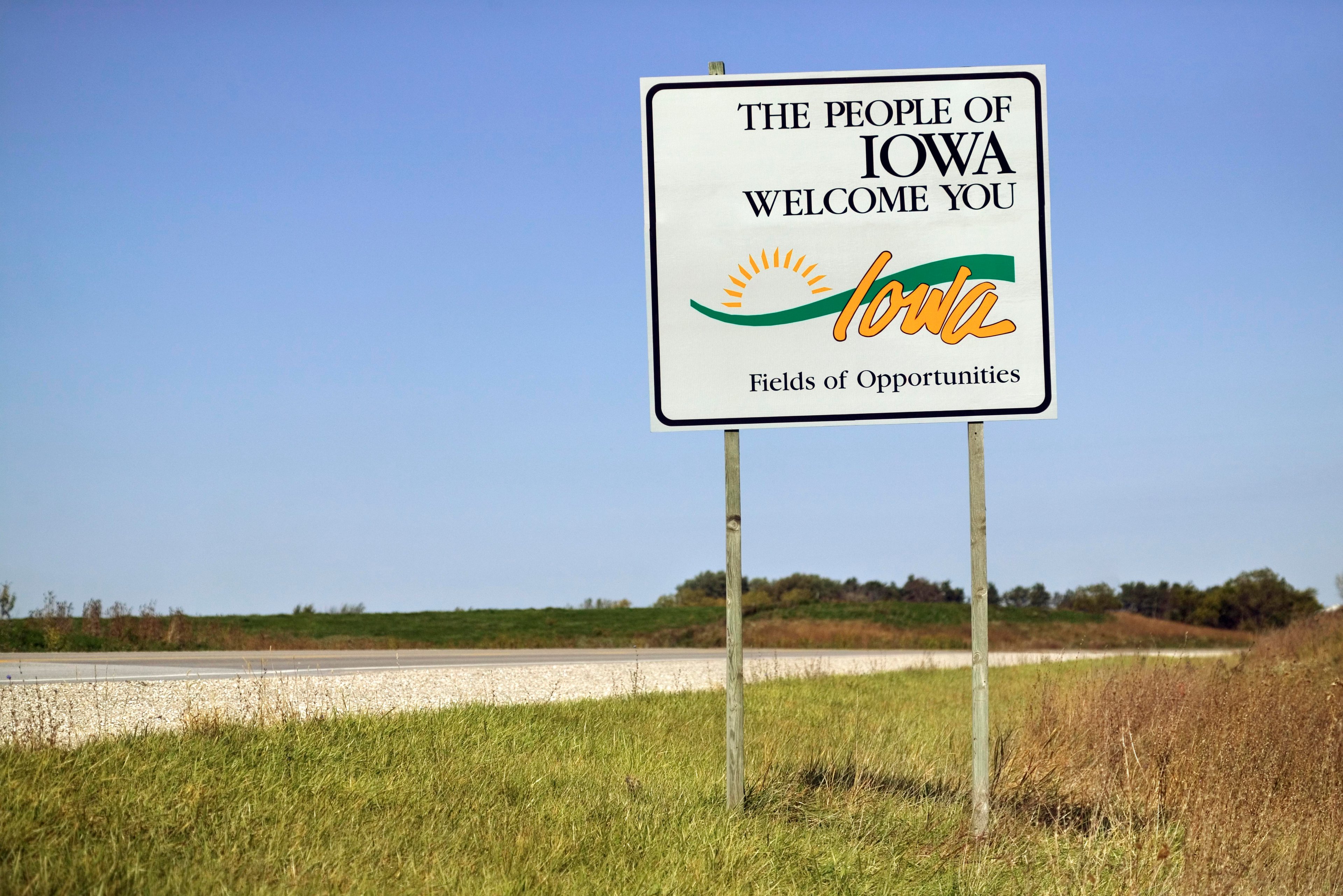 A welcome sign on the border of Iowa.