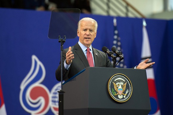 Joe Biden speaking behind a podium