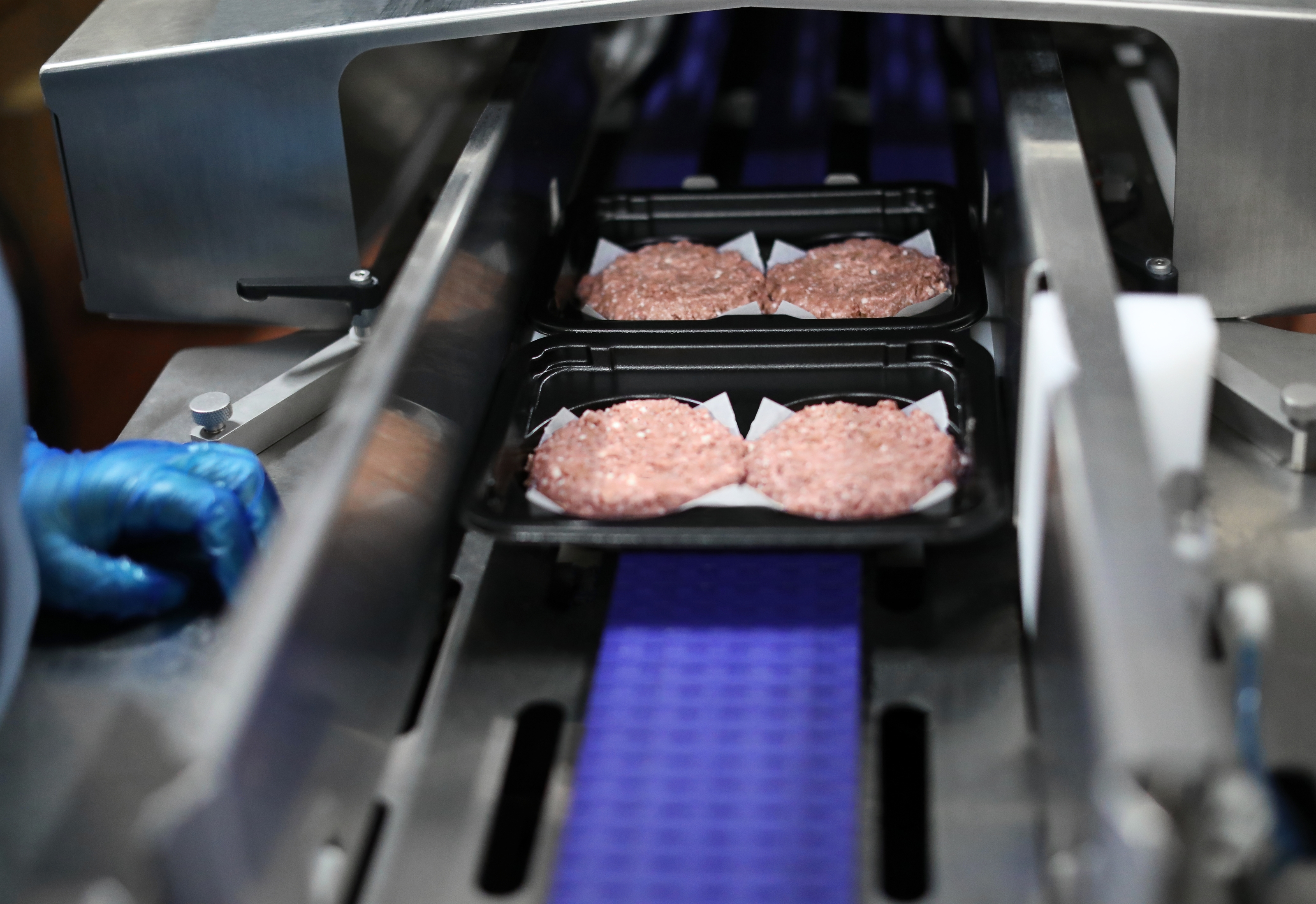 Beyond Burger patties in trays during the manufacturing process
