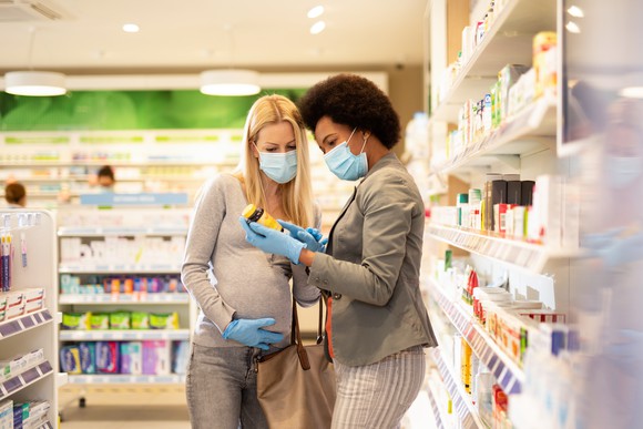 Women shopping at a pharmacy. 
