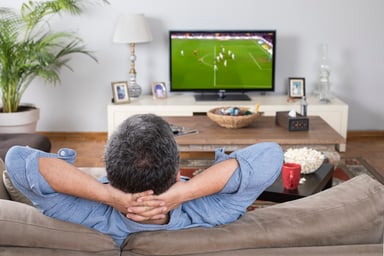 Person Watching Game on the Couch