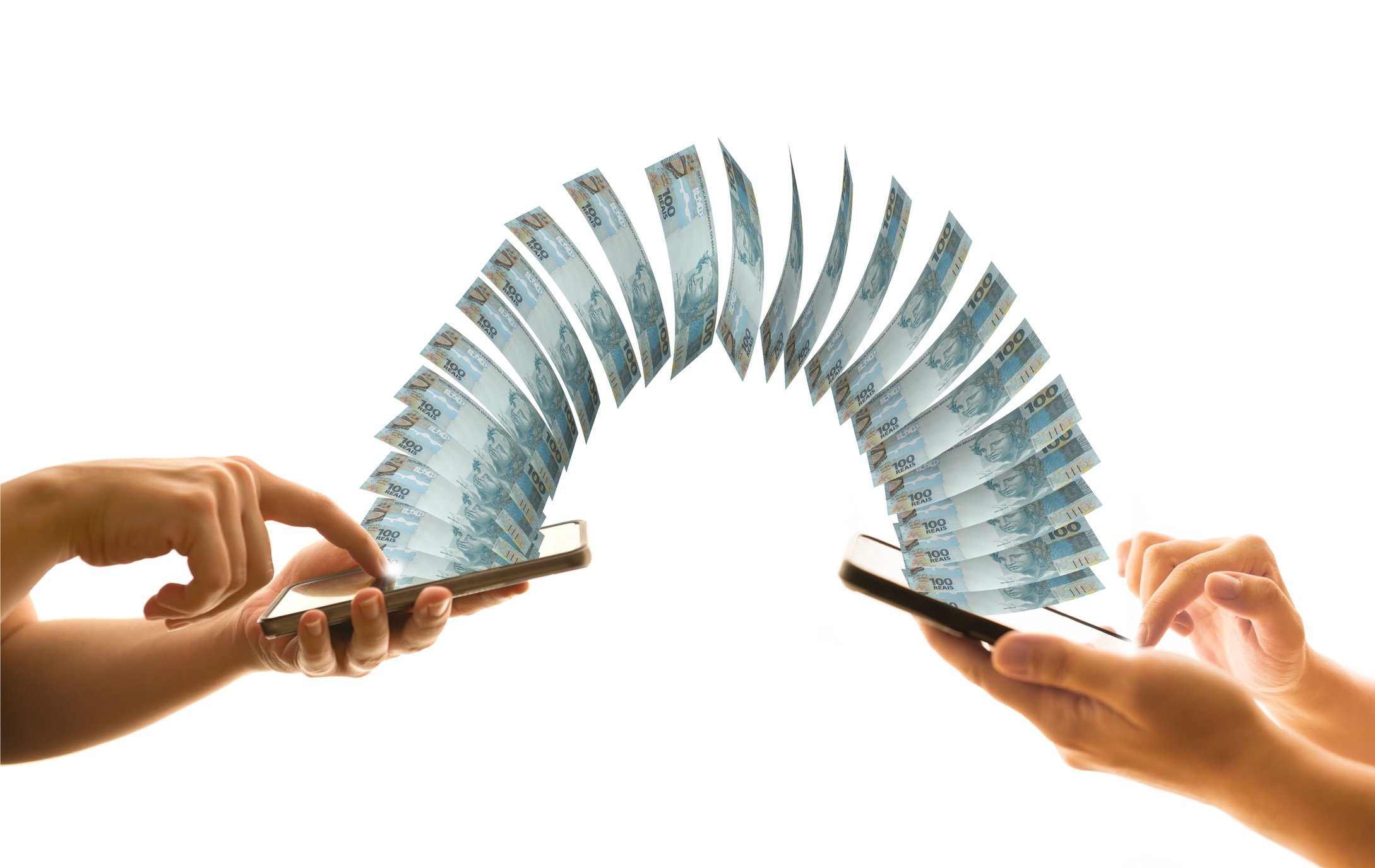 Money transfer concept showing dollar bills moving between two tablets.