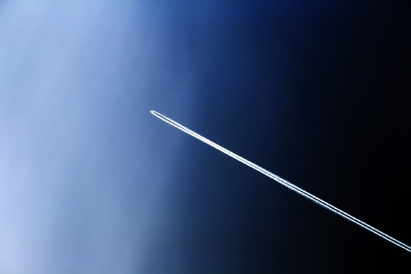 A rocket journeying into space.