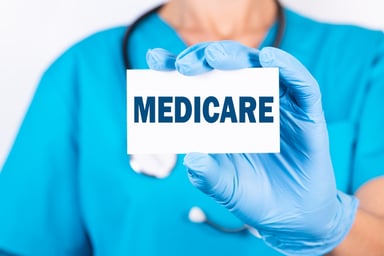 Doctor holding Medicare card