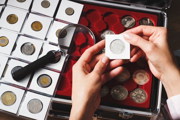 coin collector examining coins