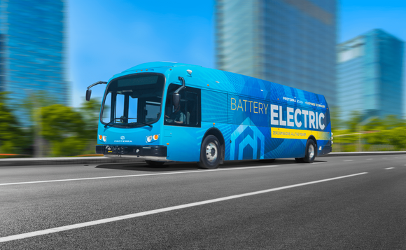 Proterra electric bus driving down the street