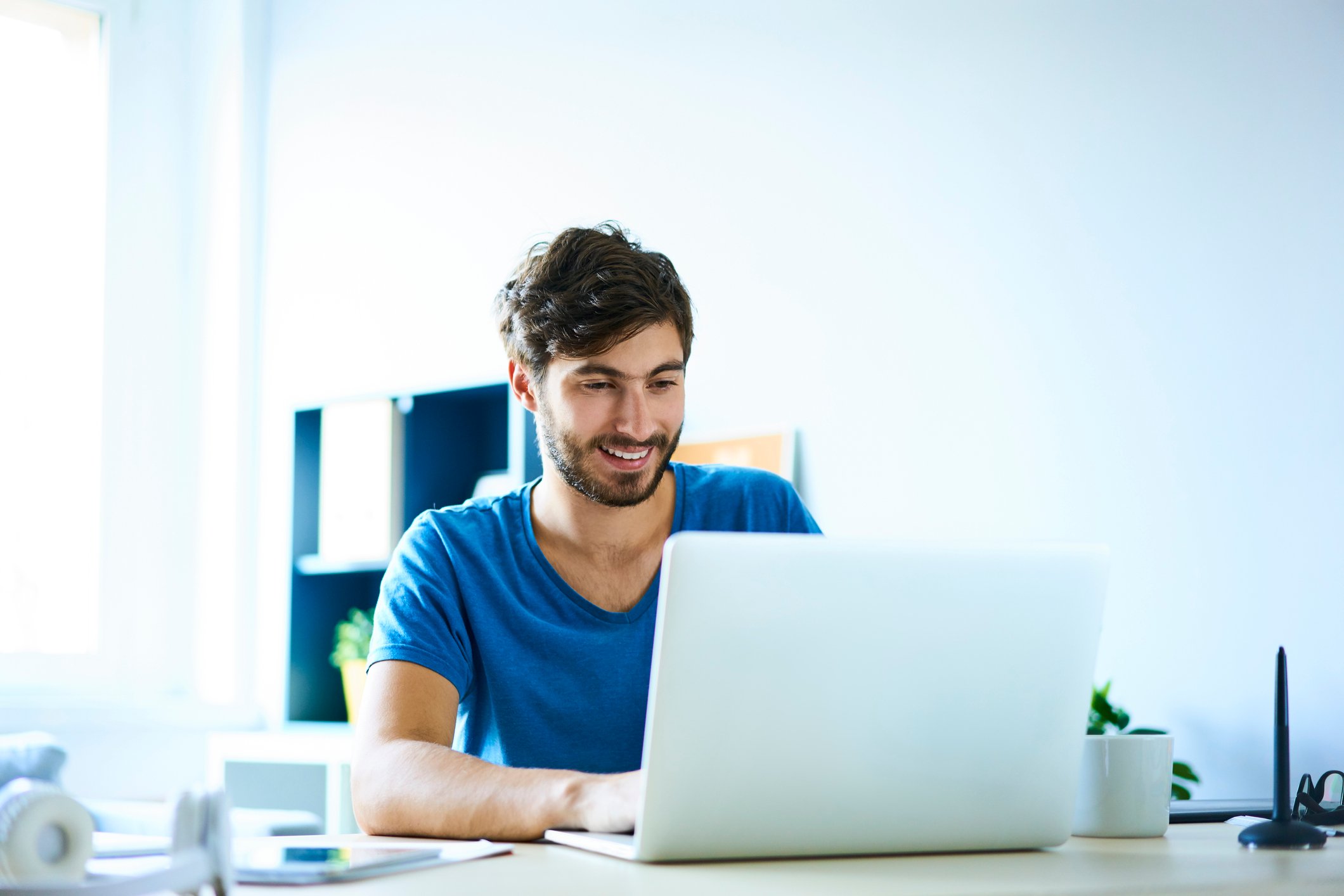Smiling person at laptop