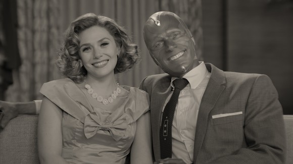 A woman and an android man dressed in 1950's era clothing.
