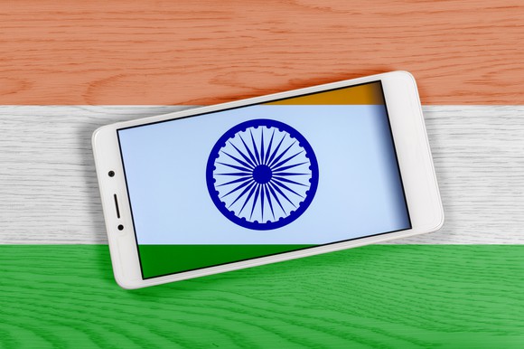 A smartphone kept on the Indian flag.
