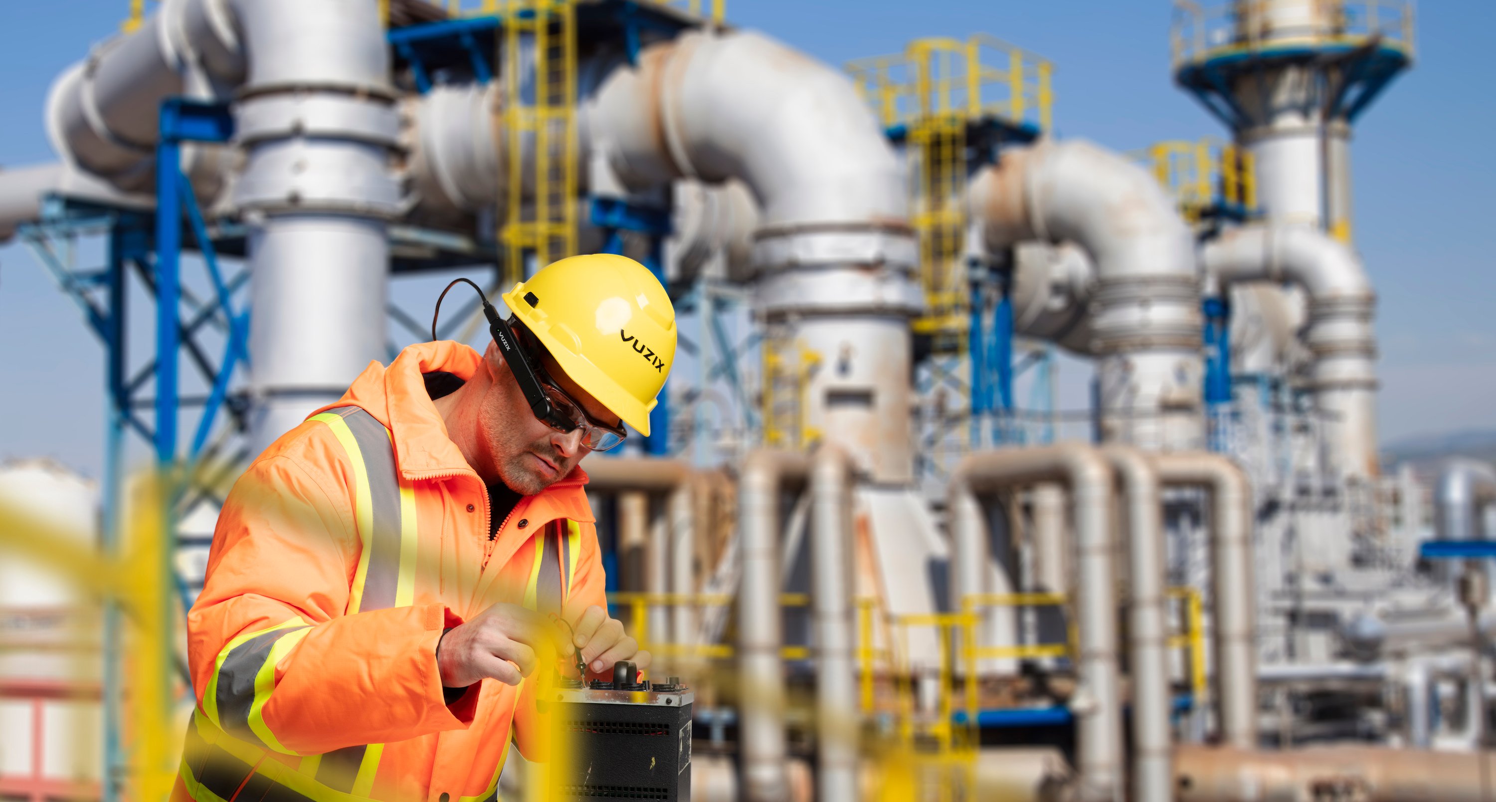 A field technician wearing Vuzix smart glasses