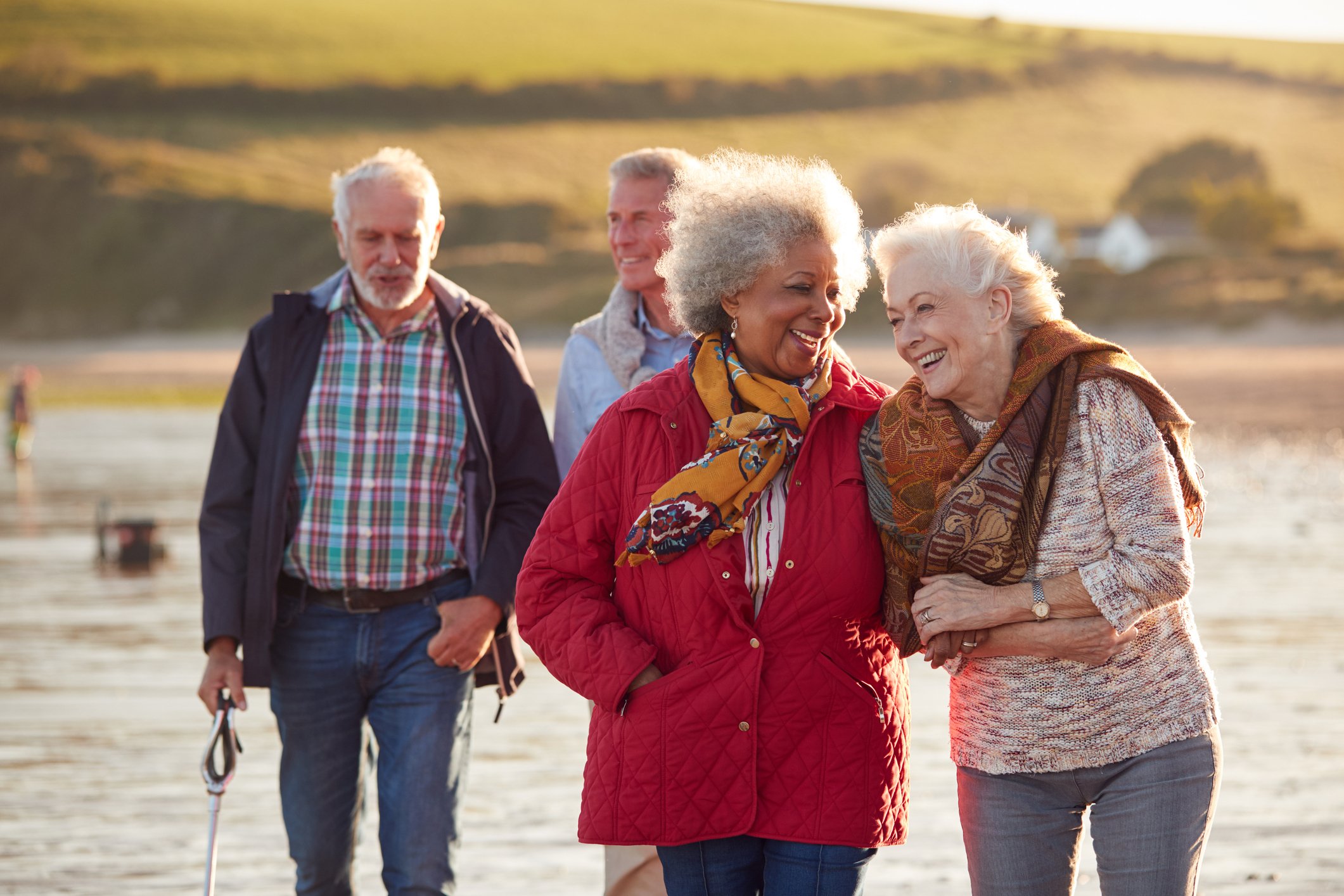 Seniors walking together by a lake