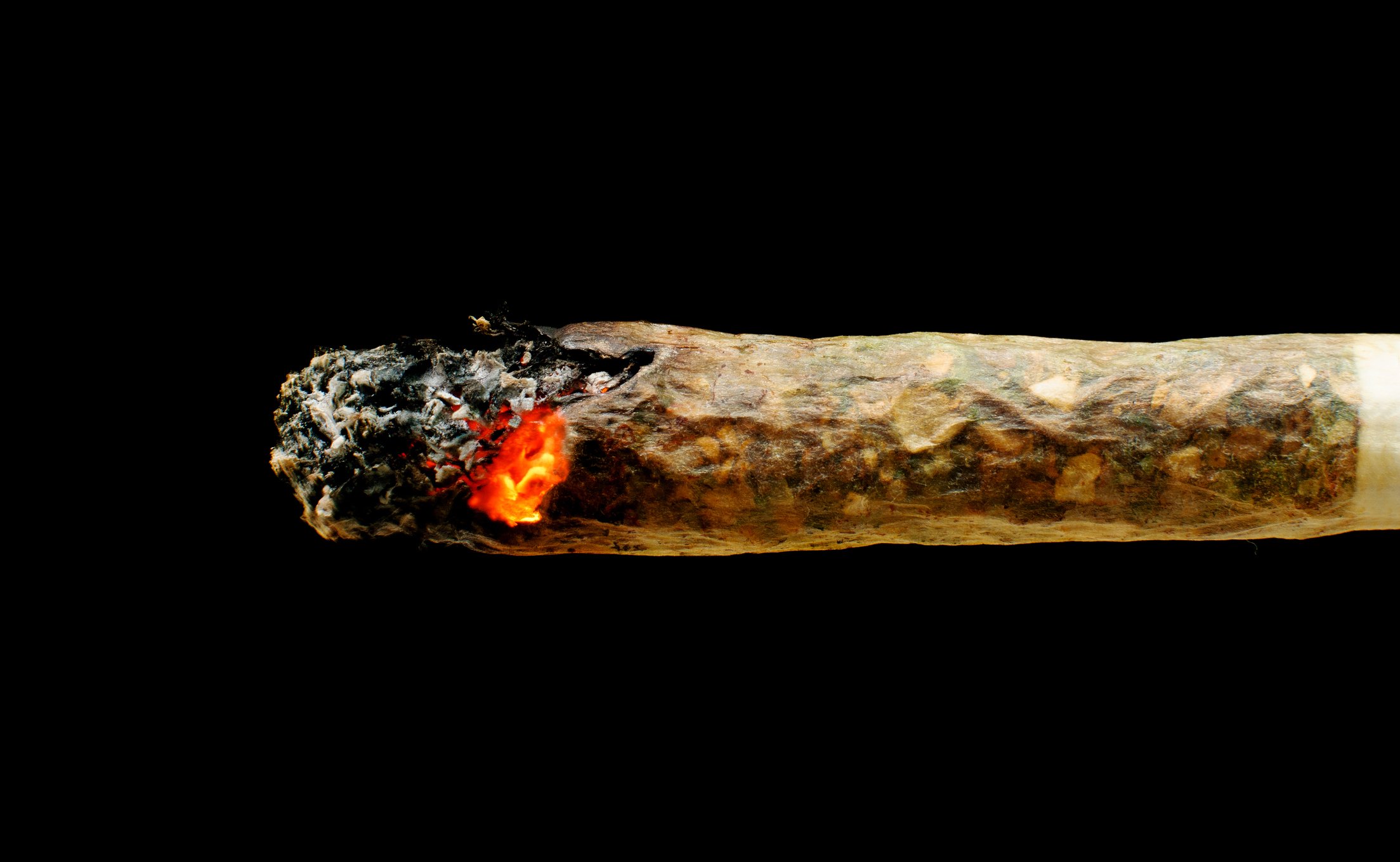 Burning red marijuana joint