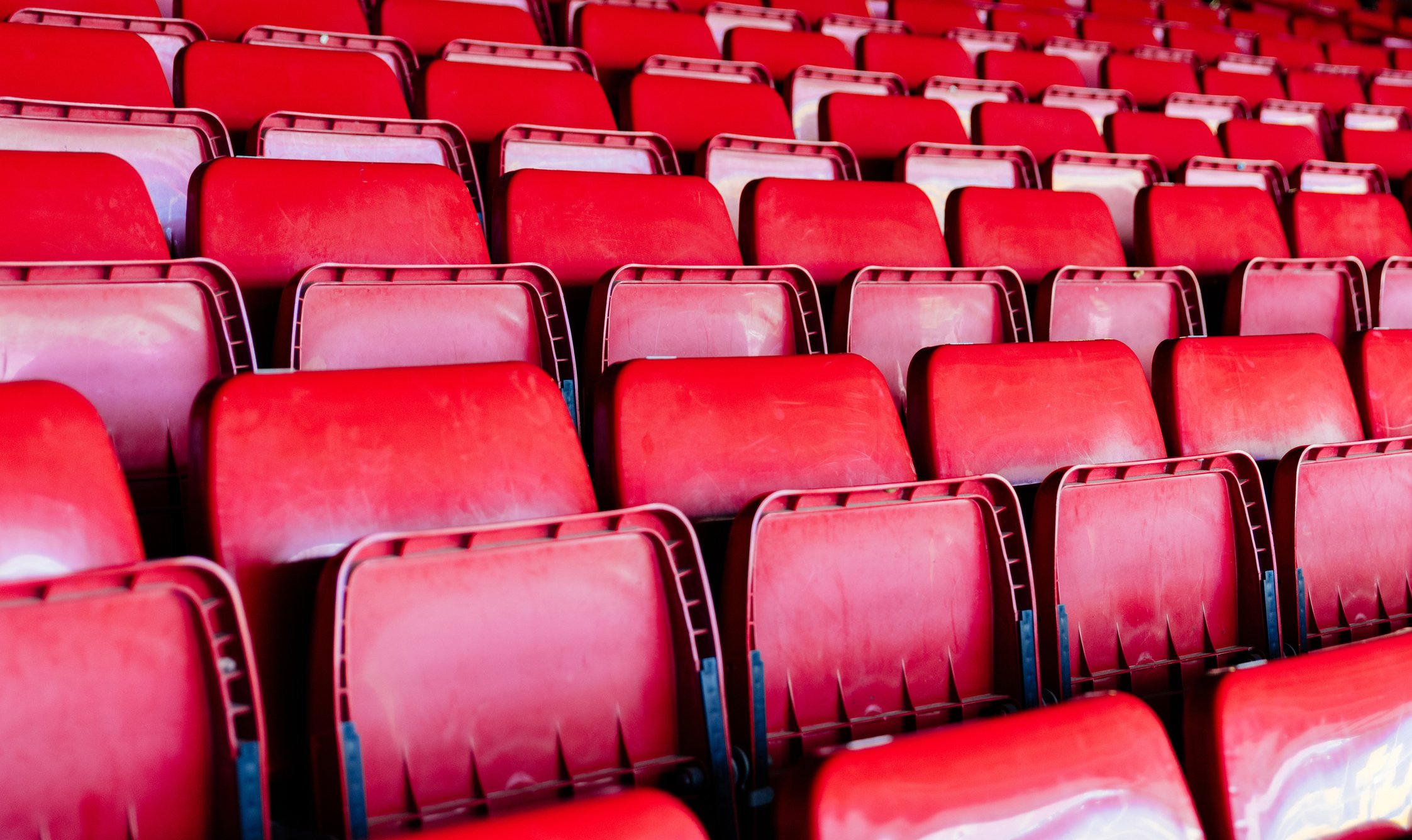 A group of empty seats at an entertainment venue. 