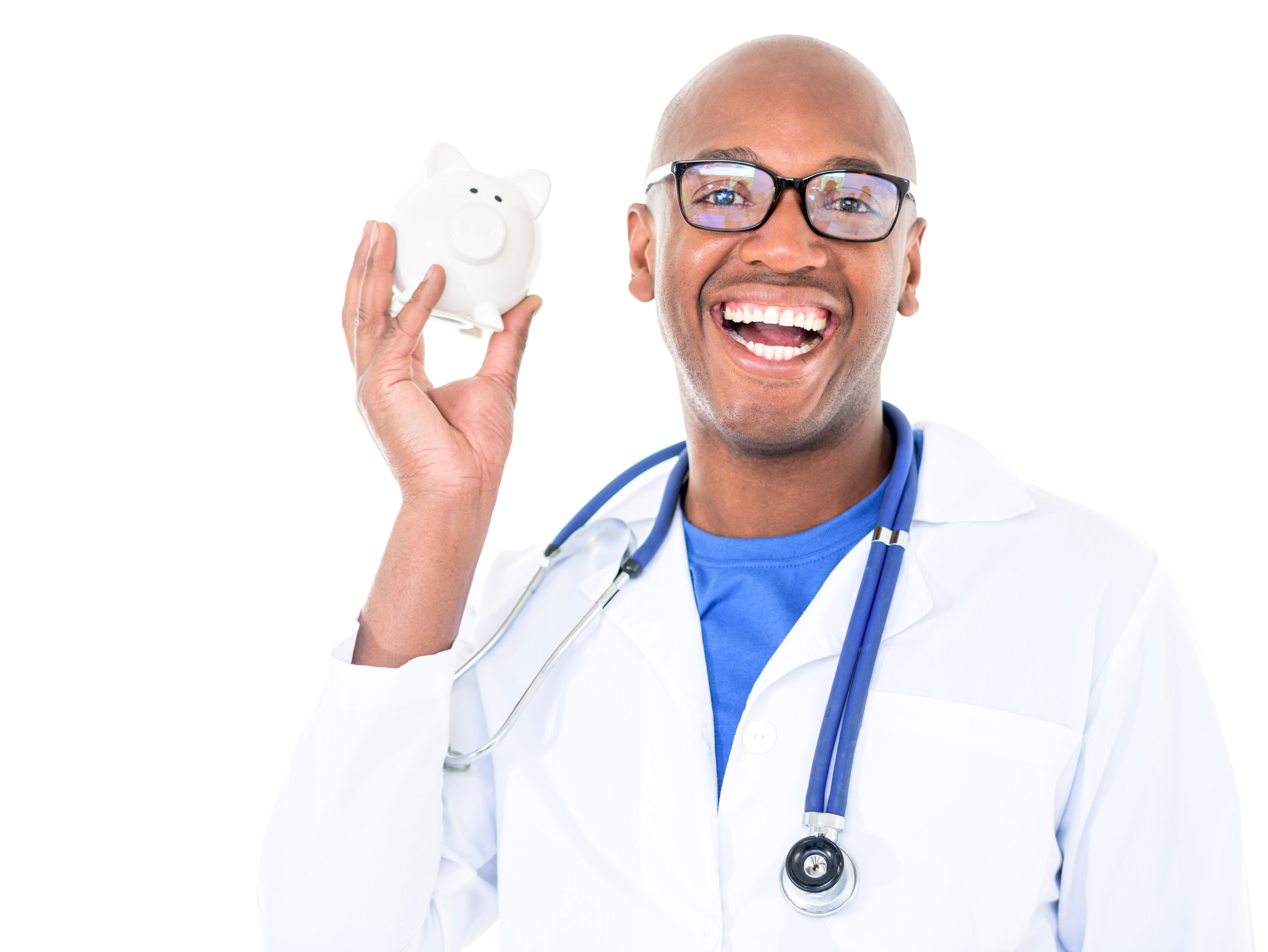 A young doctor with glasses holds a piggy bank and smiles.