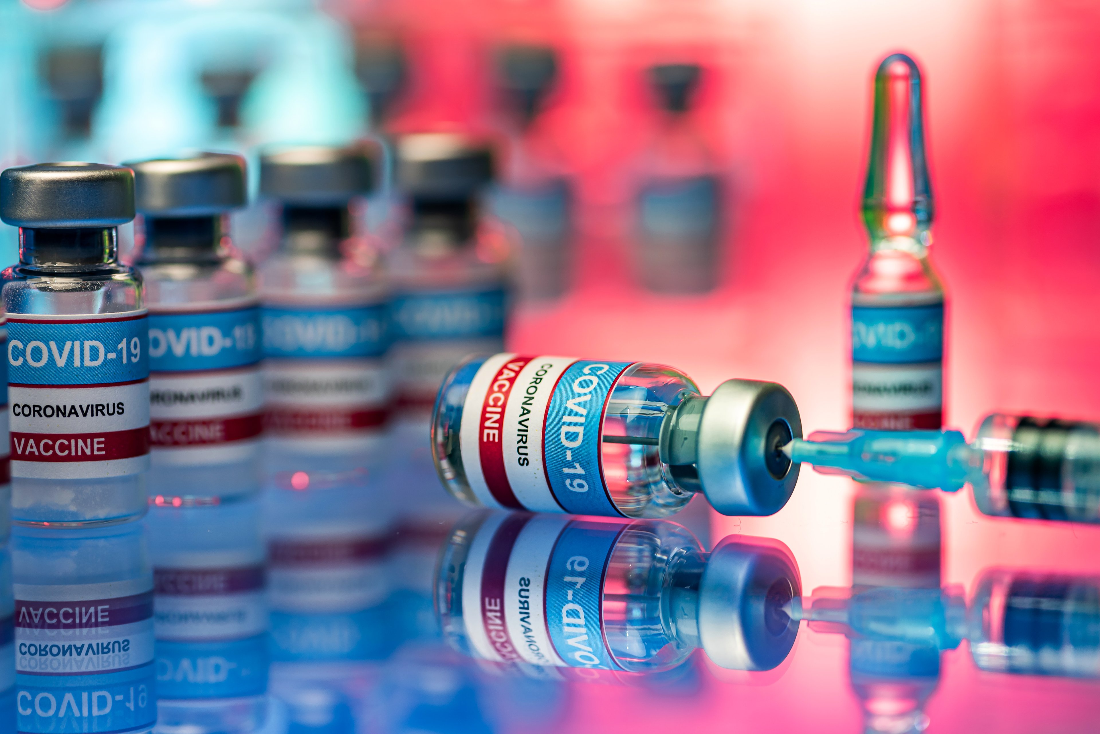 Coronavirus vaccine vials and syringe. 