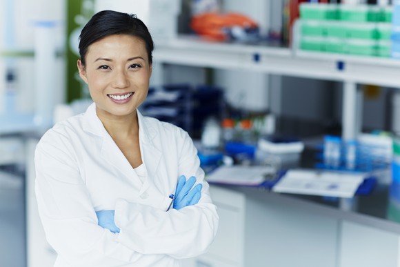 Smiling scientist in a laboratory.