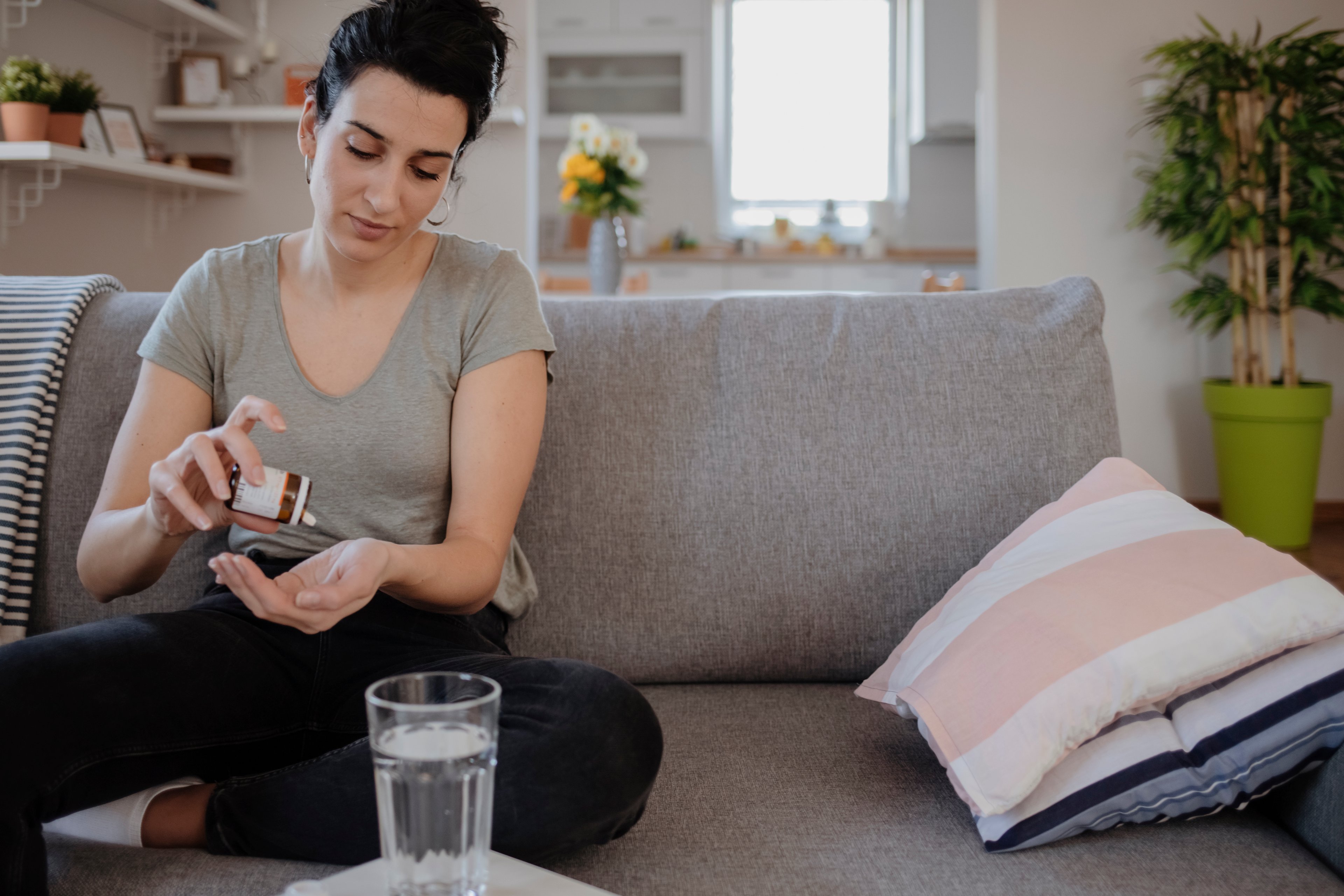 Woman taking a pill. 