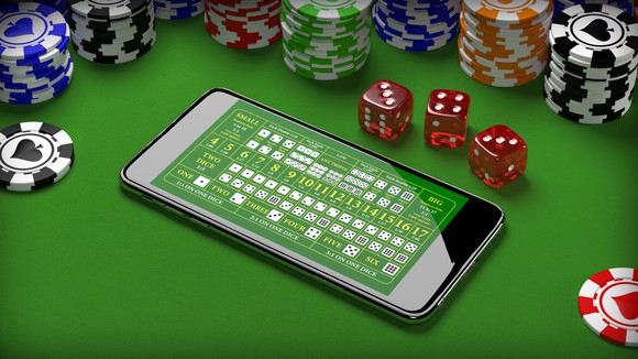 Casino table with chips and a smartphone. 
