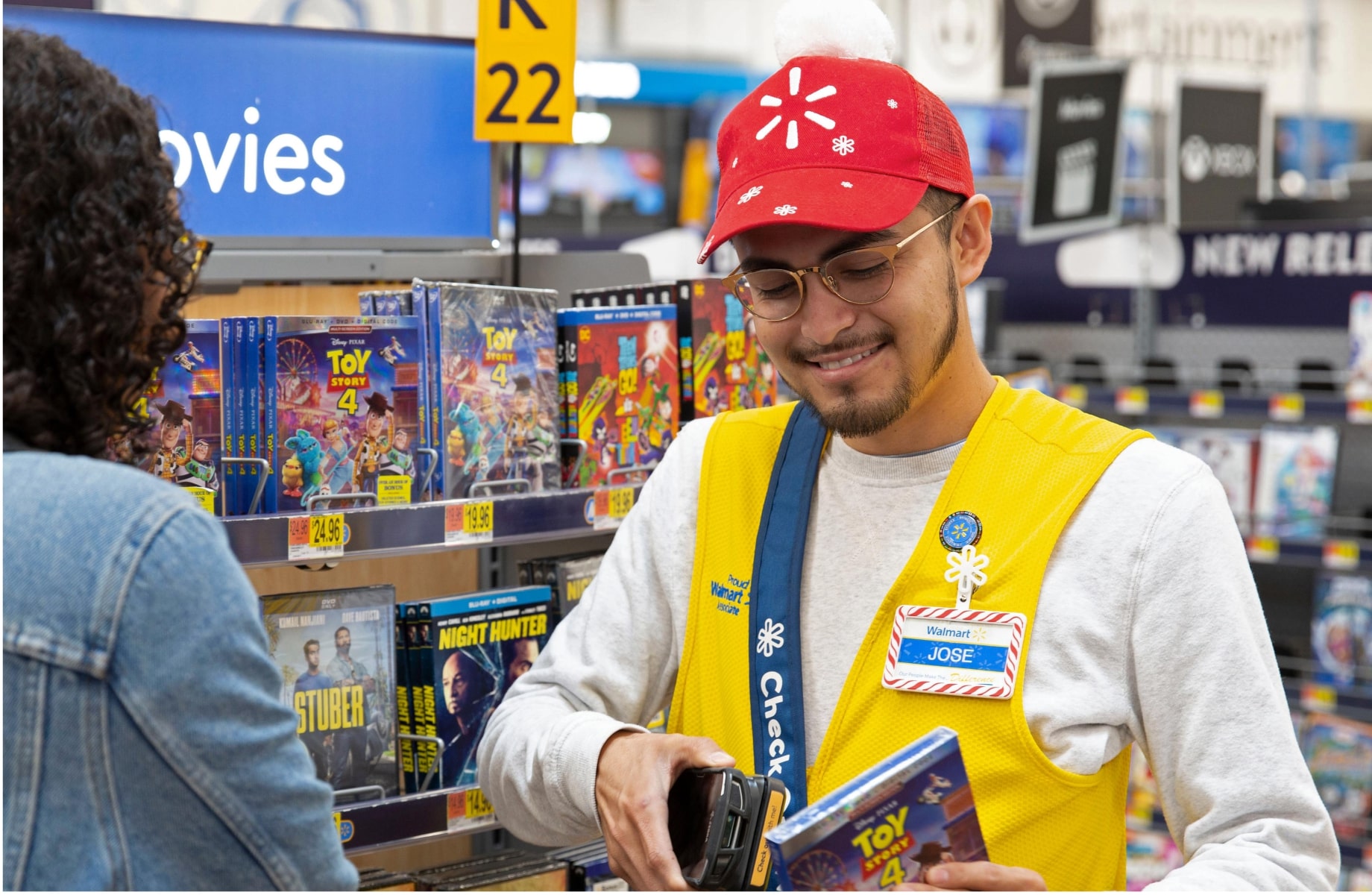 A Walmart employee scanning a product.
