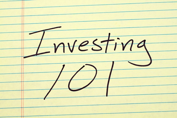 Yellow legal pad paper with the words "Investing 101" written on it.