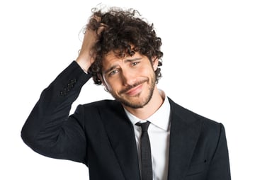 Confused Latin American businessman