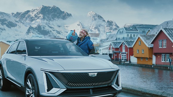 The actor Will Ferrell, with a Cadillac Lyriq in a Norwegian town. 