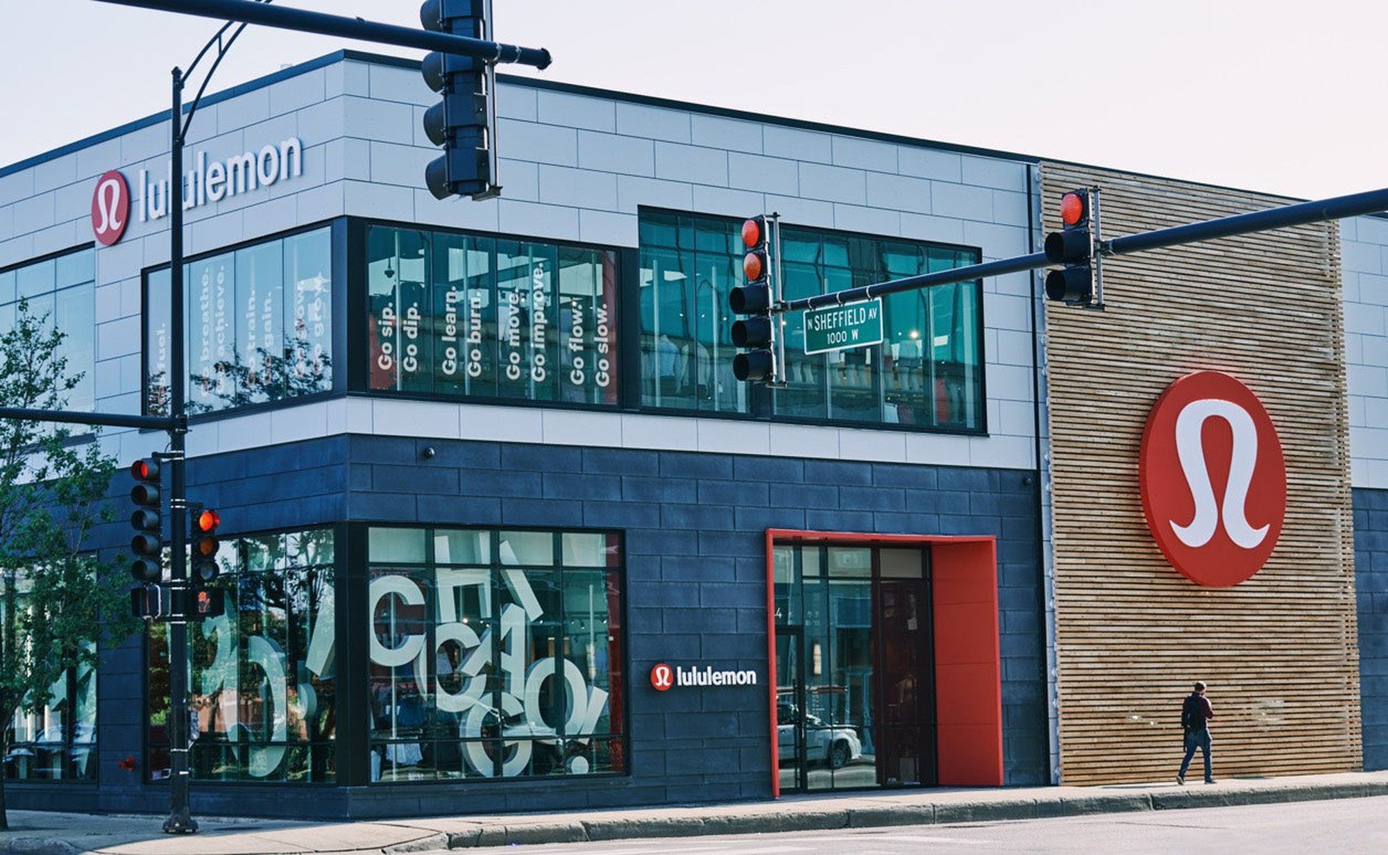 The exterior of a Lululemon store on a city street 