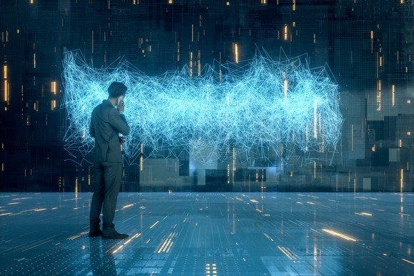 A man looks at a cloud of data.