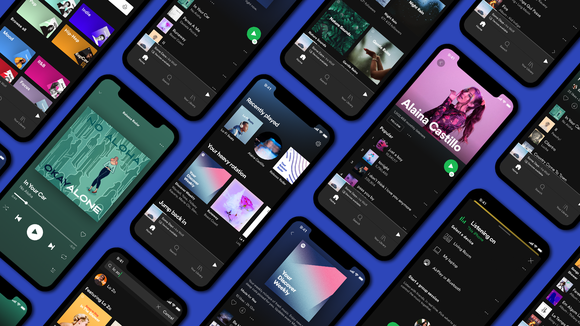Smartphones displaying various screens from the Spotify app.