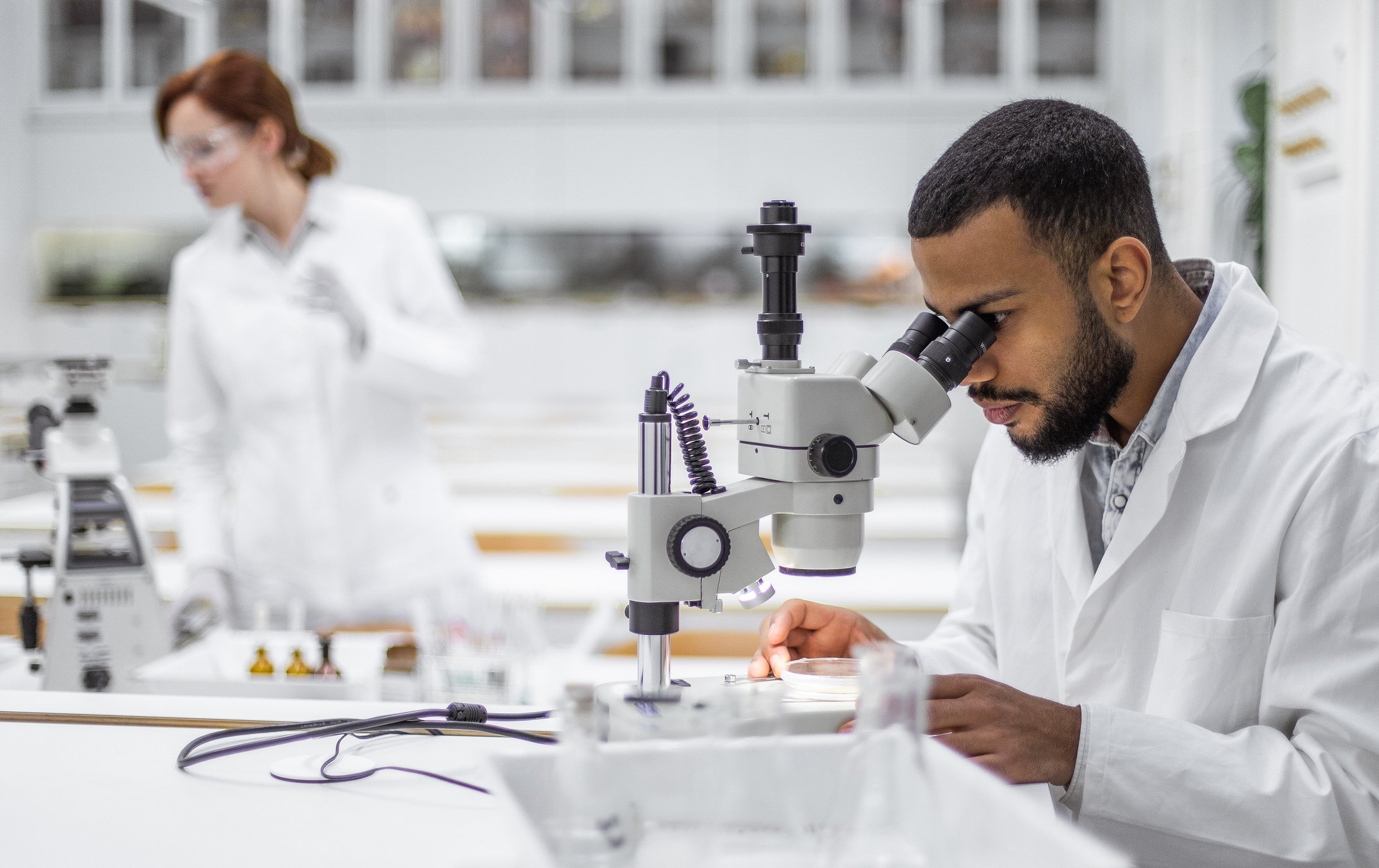 Scientist looking through microscope - Copy