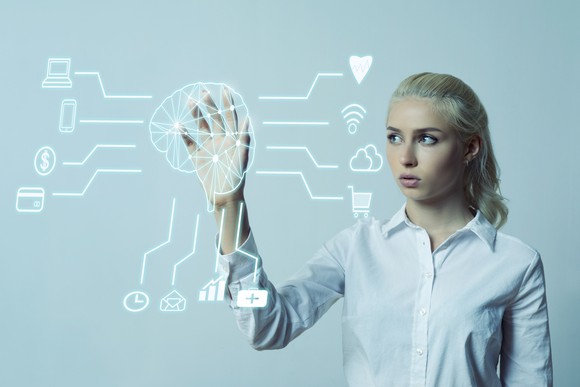 Woman interacting with digital cortex to plan an ad campaign.