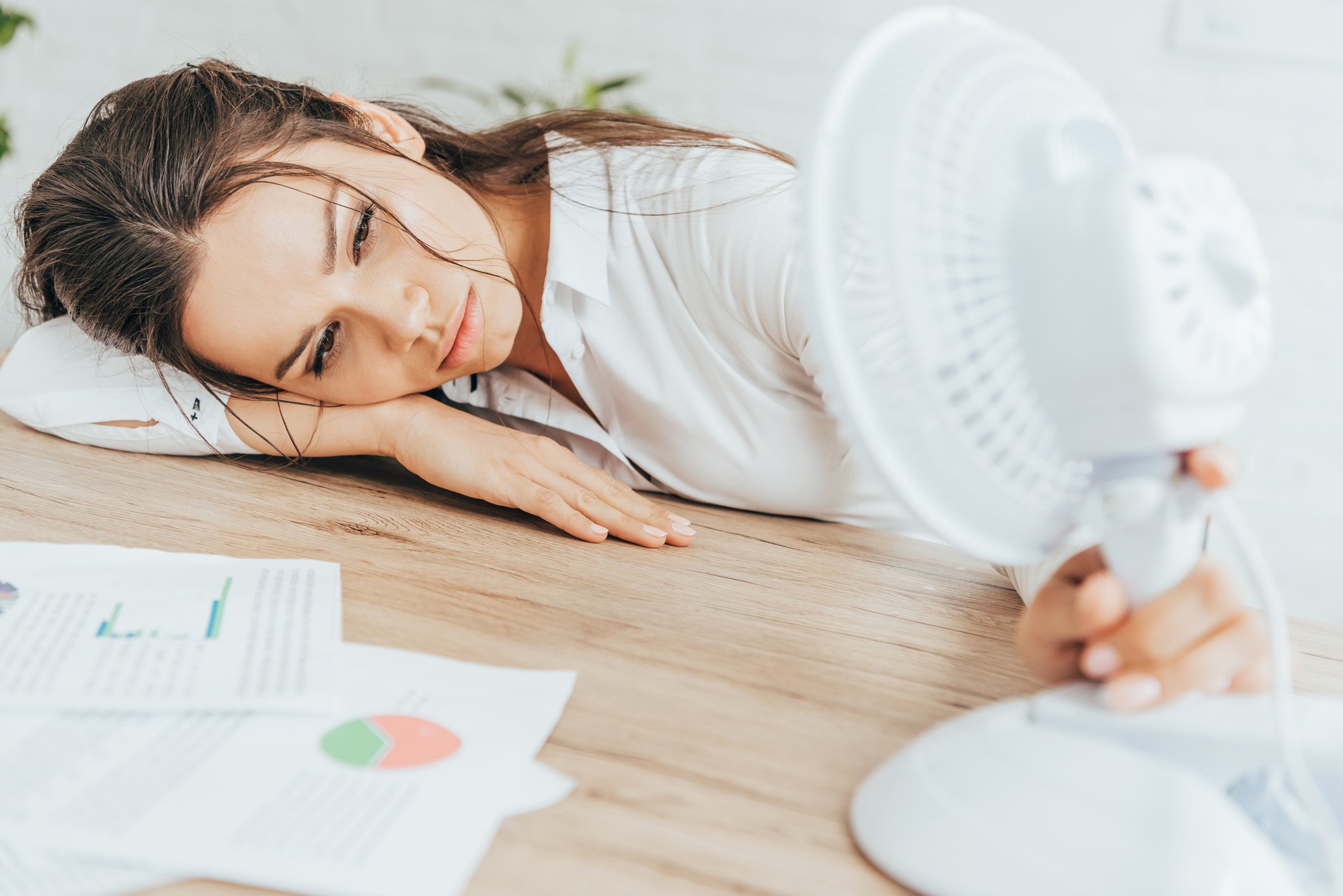 An office worker dreaming of air conditioning.