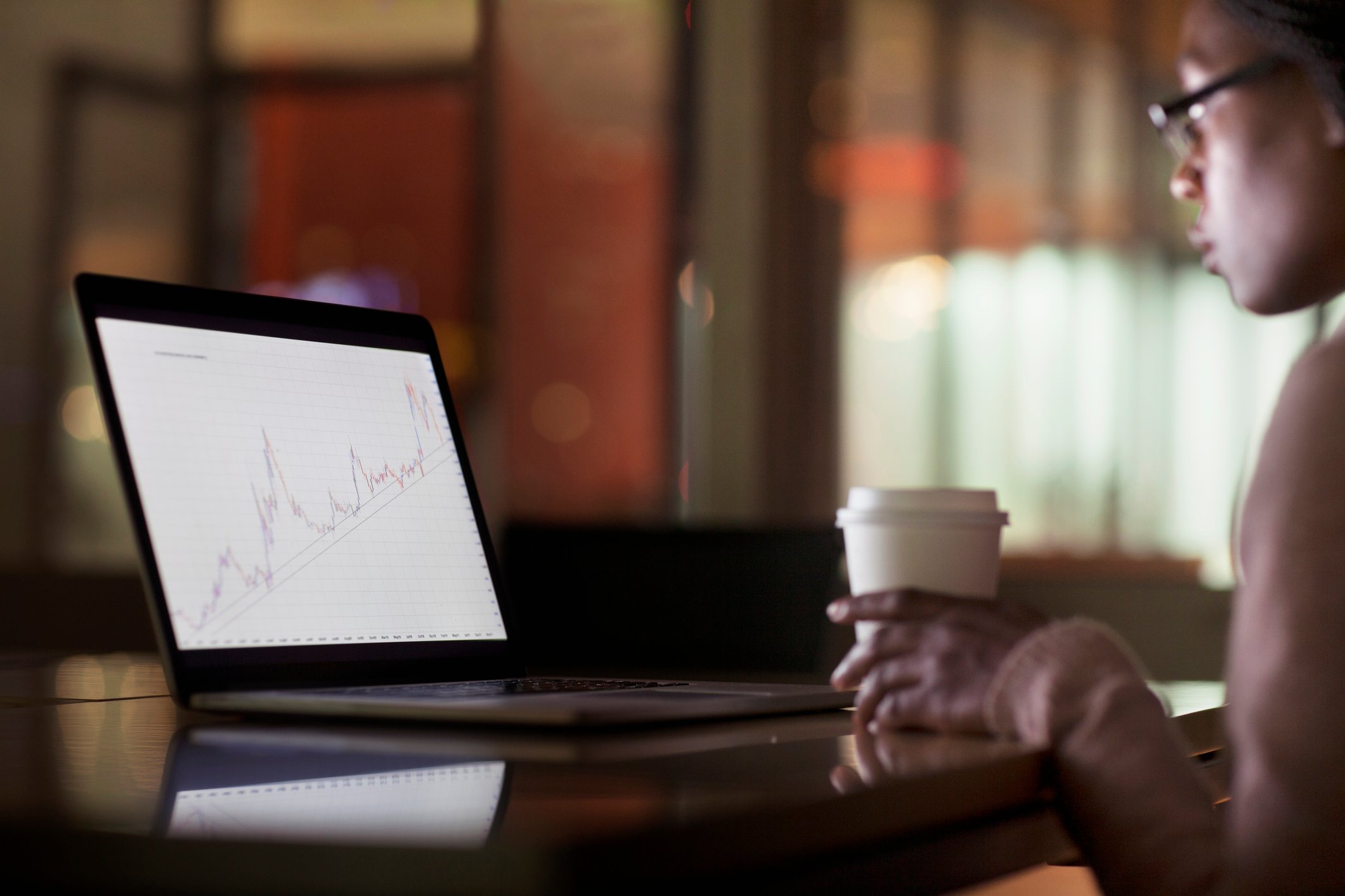 A woman looking at a computer screen.