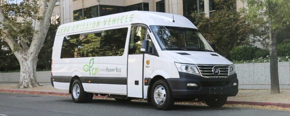 A white GreenPower EV Star, a battery-electric shuttle bus.