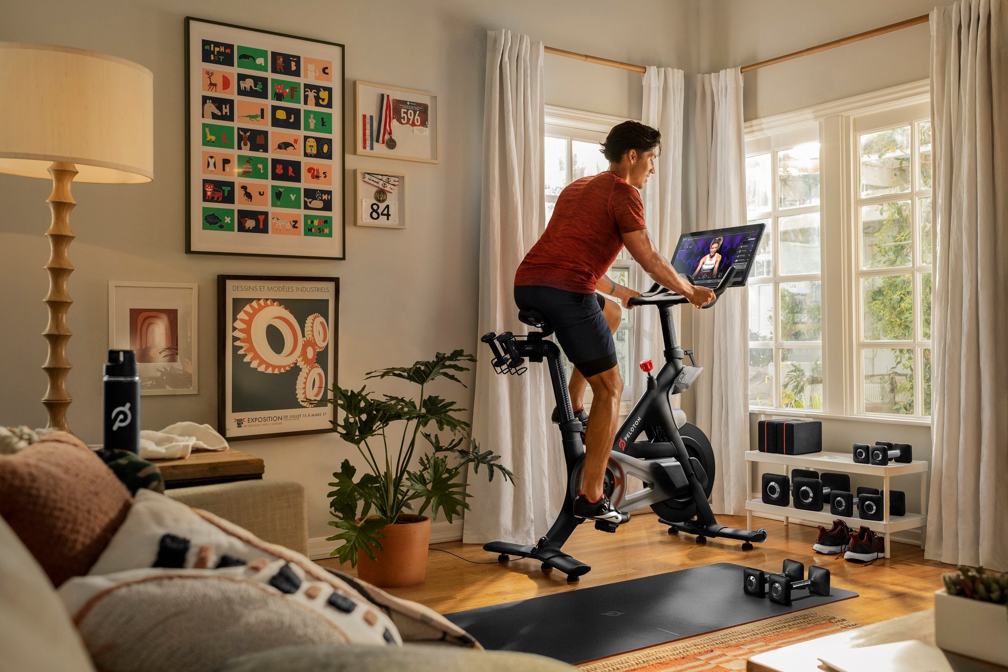 A Peloton Bike owner uses the equipment at home