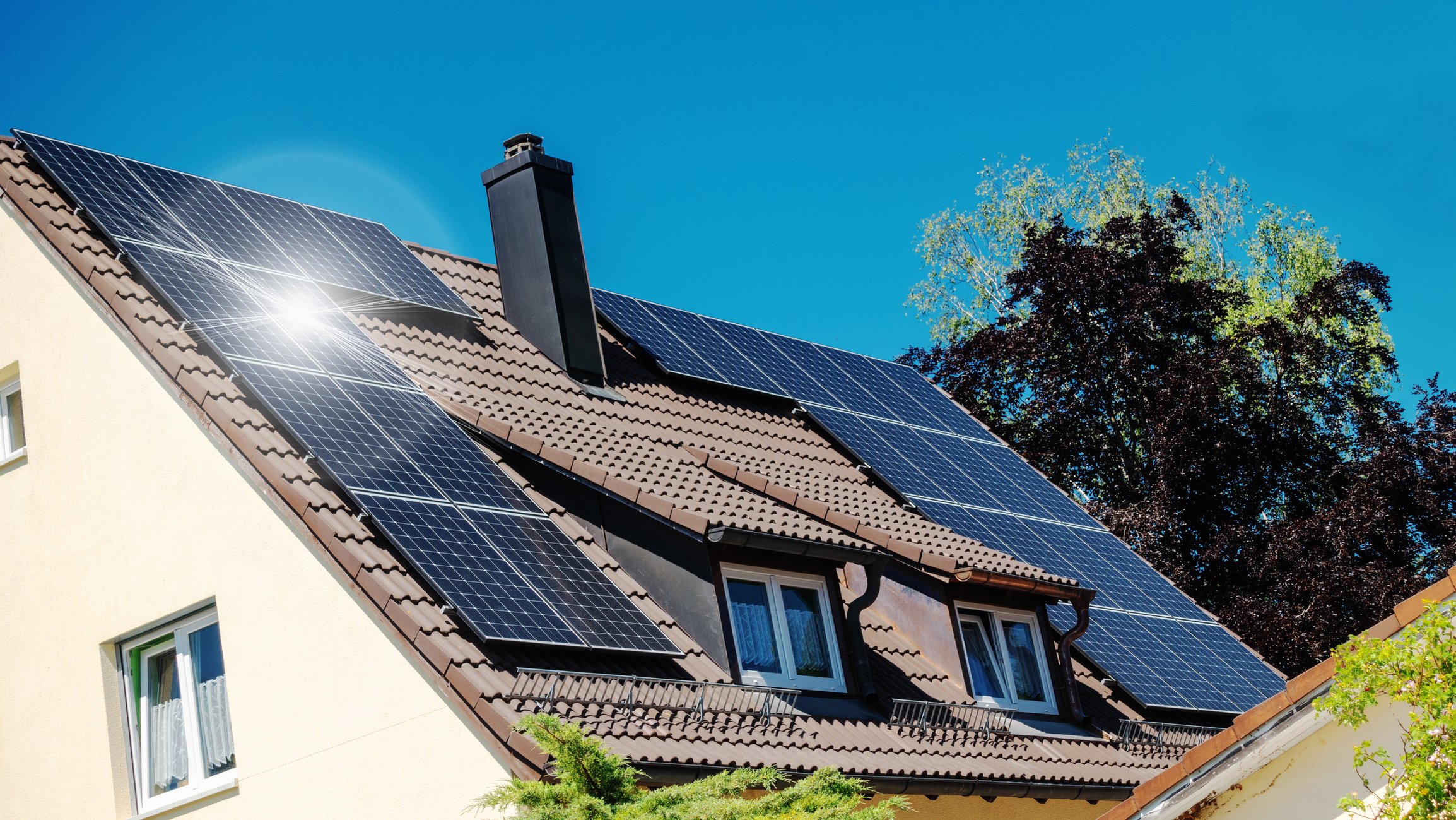 A family house with solar panels on the roof.