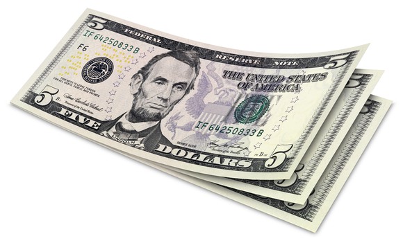 A stack of five-dollar bills.