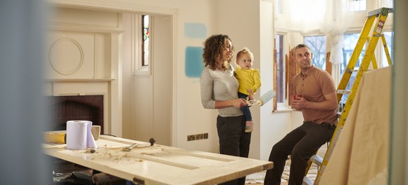 A family renovating the interior of their new house.