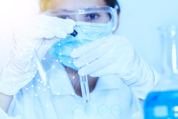 Scientist in a lab holding a test tube