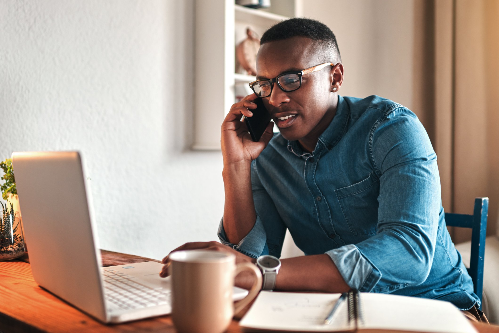 Man talking on the phone at home. 