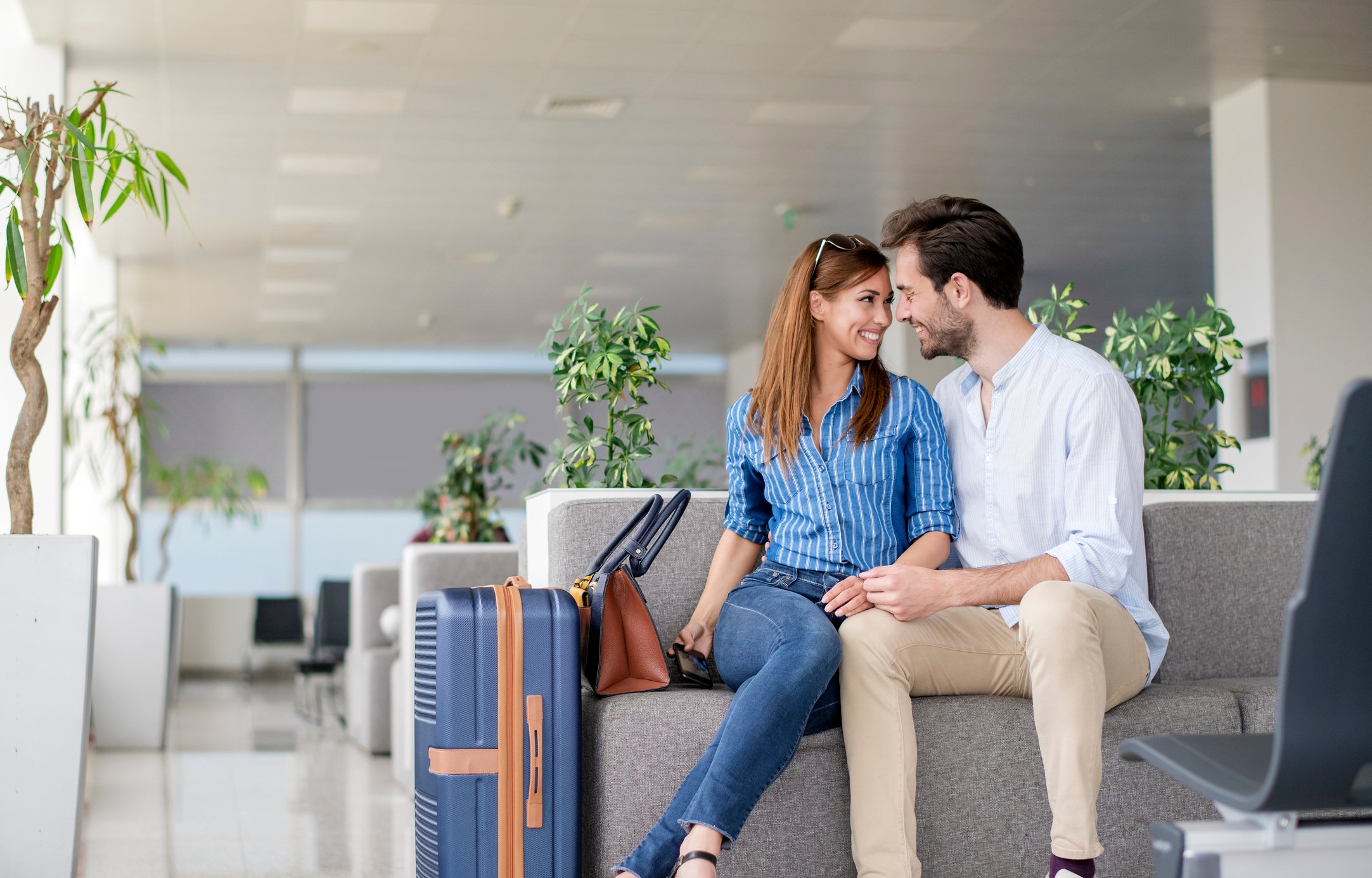 A couple in an airport.