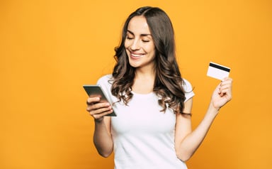 Woman with credit card and smartphone