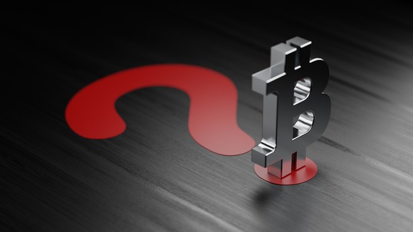 A silver Bitcoin symbol is placed on the dot below a red question mark.