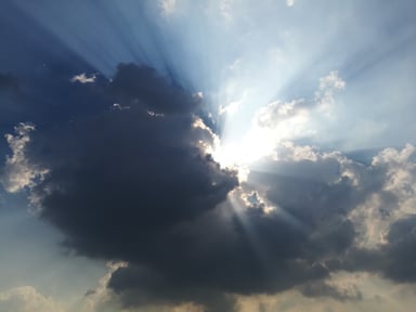 Sun Breaking Out of Clouds