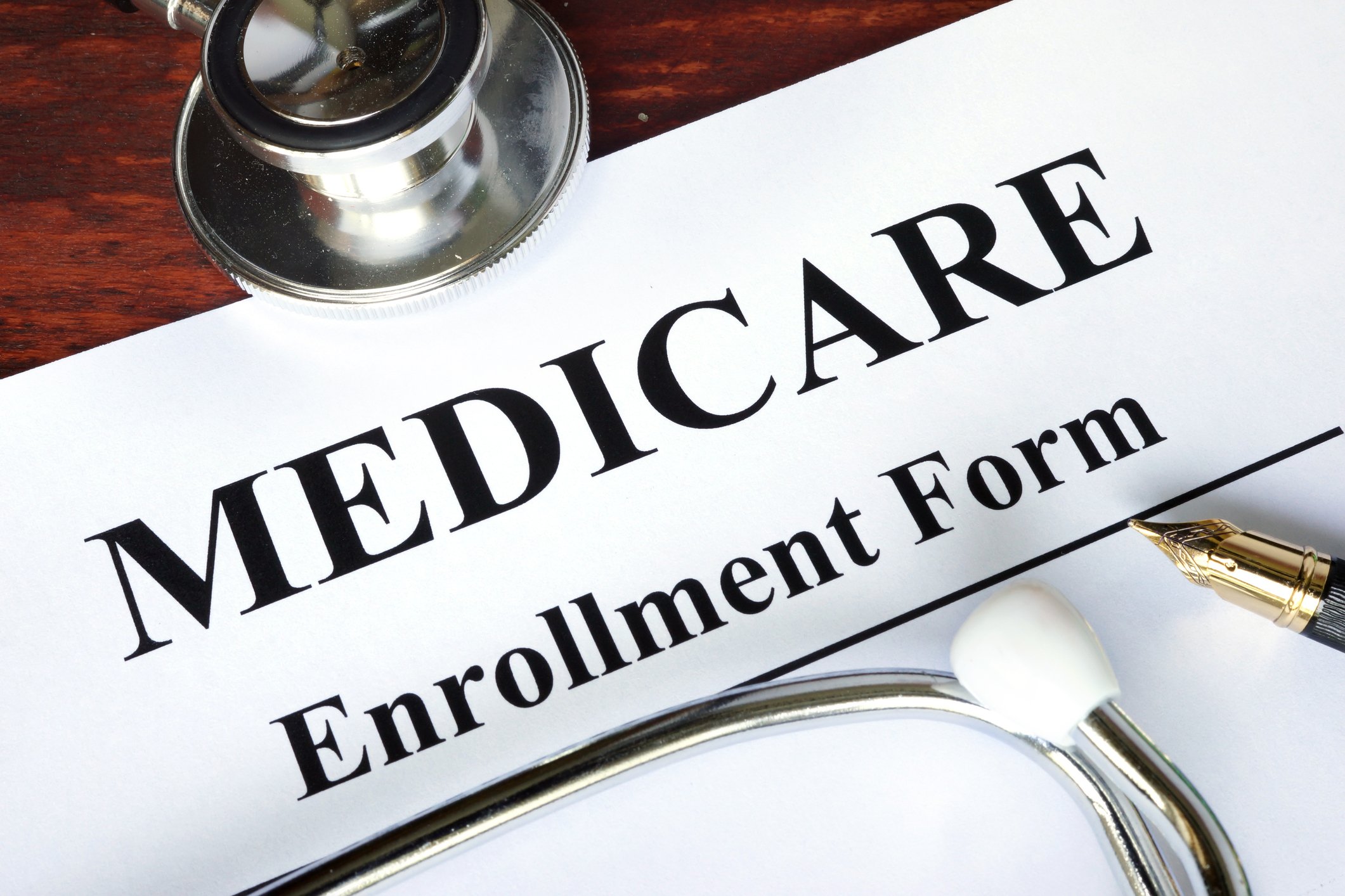 Medicare enrollment form with stethoscope resting on it