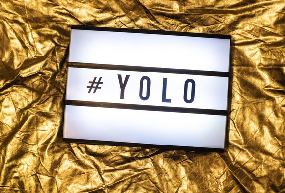 Sign the has a hashtag and the acronym "YOLO"