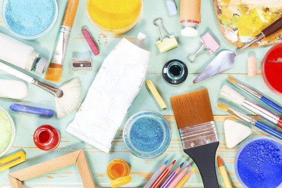 arts and crafts supplies including paints and brushes