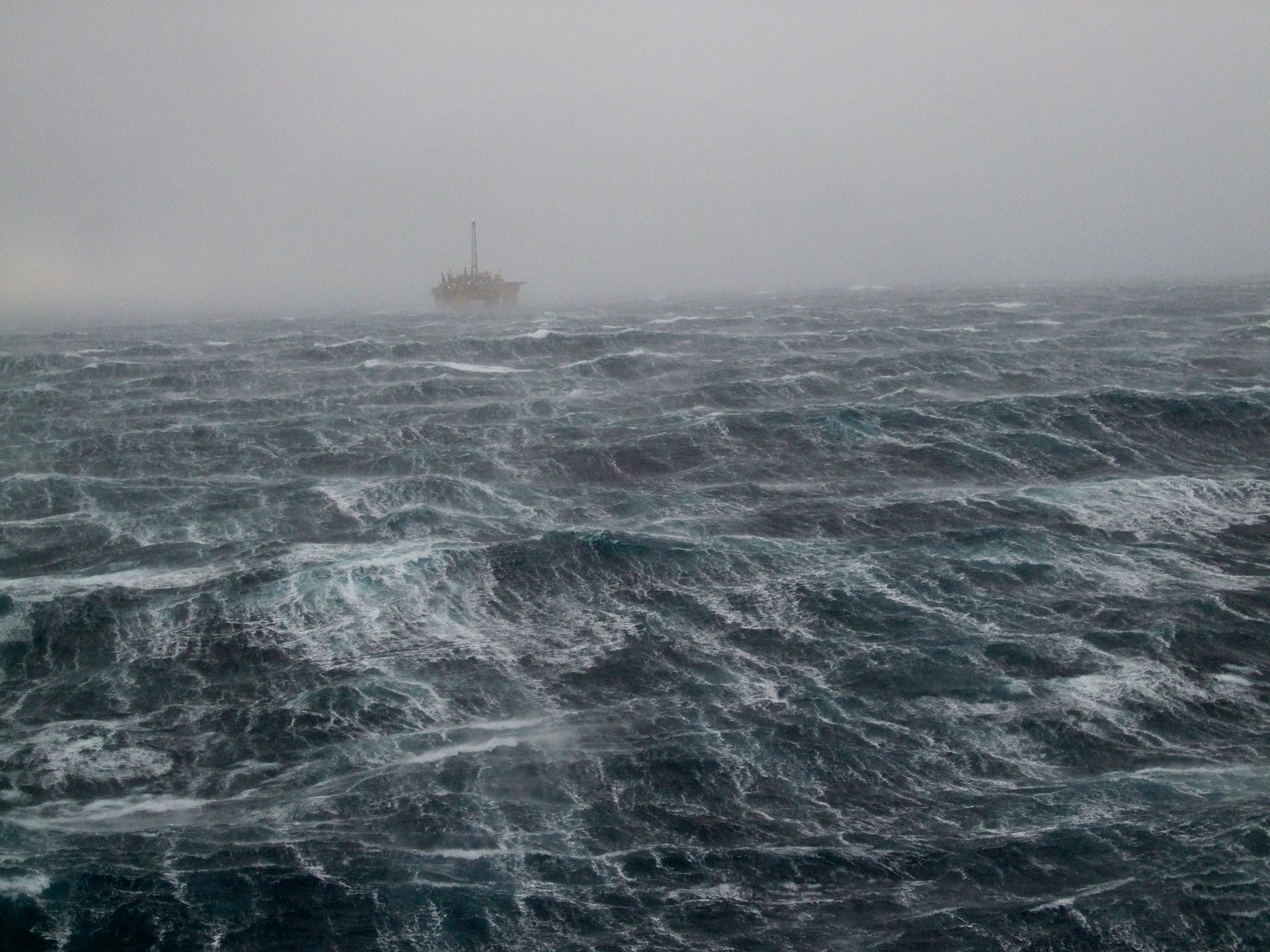 An offshore oil rig amid the choppy waters of the North Sea.